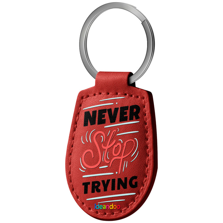 Portachiavi in pelle Never stop trying dell'album Never stop trying di Ideandoo con anello in metallo, Disponibili in 6 Colori, Stampa di Alta Qualità